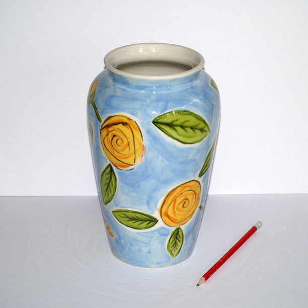 Blue ceramic vase with roses