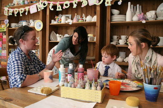 Family pottery painting session