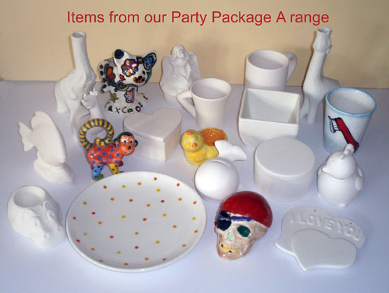 Collection of pottery items from Party Package A including mugs, plates, animals, and vases